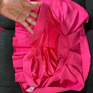 Hot pink skirt with shorts underneath never worn FITS LIKE A MEDIUM/SMALL